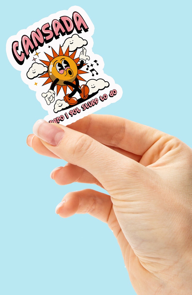 May include: A sticker with a cartoon sun character with a pink, orange, and yellow color scheme. The sun is walking on clouds and has the text "cansada pero I got stuff to do" written below it.