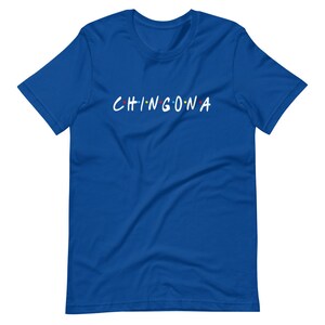 May include: A royal blue t-shirt with the text "CHINGONA" in white letters with colorful dots above each letter.