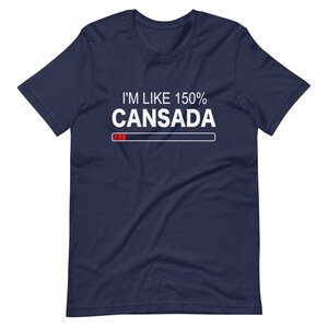 May include: A navy blue t-shirt with white text that reads "I'm like 150% Cansada" with a red progress bar underneath.