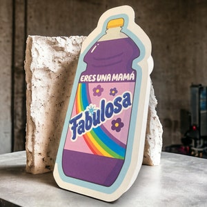 May include: A purple bottle with a rainbow and the text "Eres una mama Fabulosa" on the label.