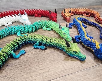 Dragón articulado antiestrés (varios colores, 2 tamaños)
