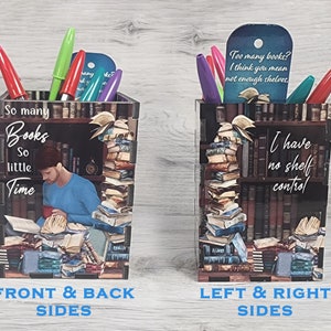 May include: A decorative pen holder featuring a bookshelf design with the text "So many books, so little time" and "I have no shelf control." The holder contains pens and bookmarks. The design includes a person reading.