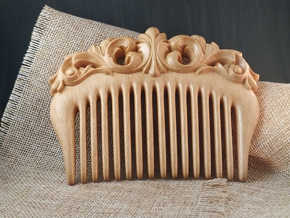 Carved wooden comb deals