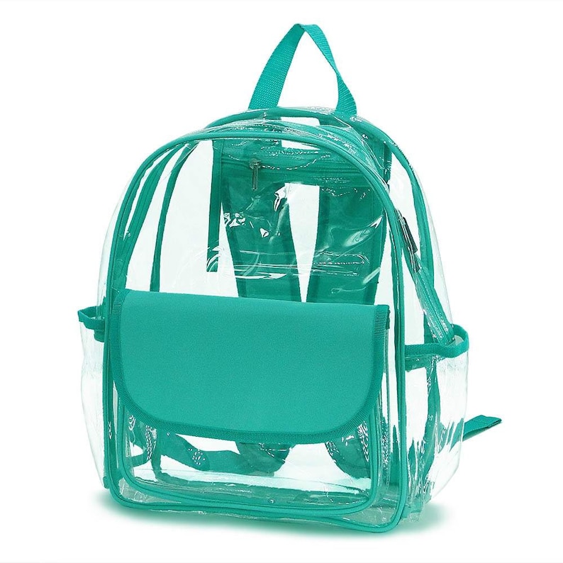 May include: Clear backpack with teal accents. Features a teal flap, handle, and trim. Includes a zippered front pocket and side pockets. The transparent design allows for easy visibility of contents, making it suitable for various uses.