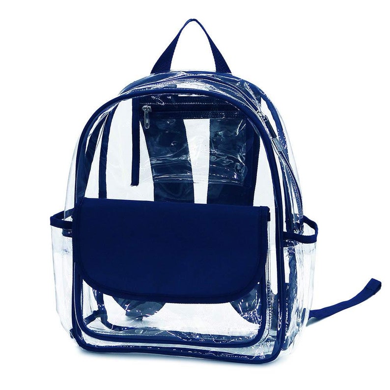 May include: Clear backpack with navy blue accents. The backpack features a clear body with navy blue trim, a front flap, and a top handle. It has a zippered main compartment and a small side pocket. The straps are navy blue.