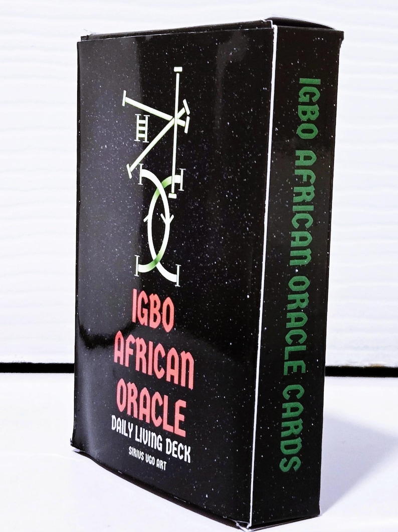 May include: A black box of Igbo African Oracle Cards. The box features green and red text with the words "Igbo African Oracle" and "Daily Living Deck". The box has a starry background and a green and white graphic.