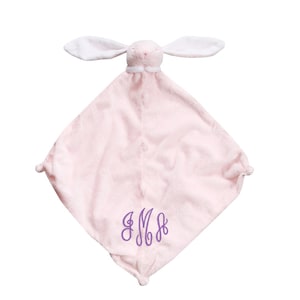 May include: A pink plush bunny security blanket with white ears and a purple embroidered monogram "MMB".