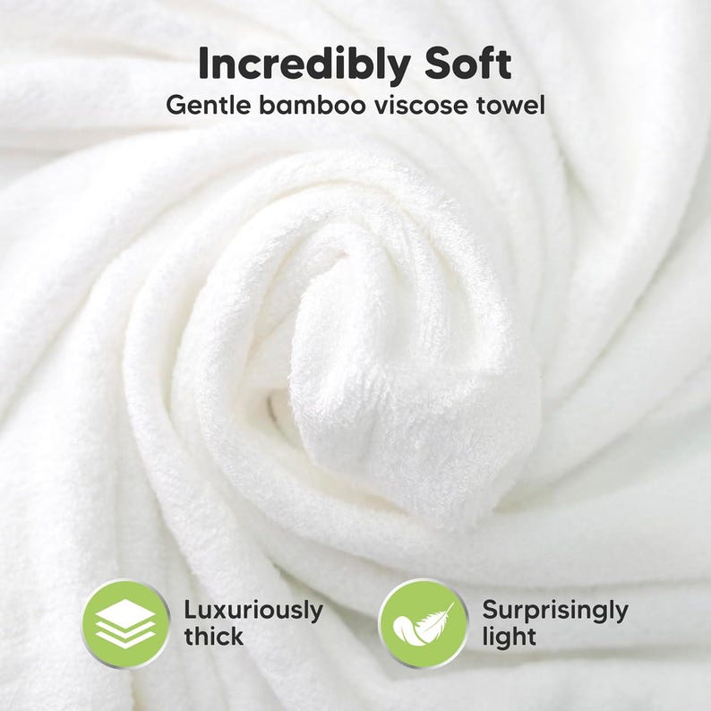 May include: A close-up of a white, folded towel. The towel is made of bamboo viscose and is described as incredibly soft, luxuriously thick, and surprisingly light. Text on the image reads "Incredibly Soft" and "Gentle bamboo viscose towel."