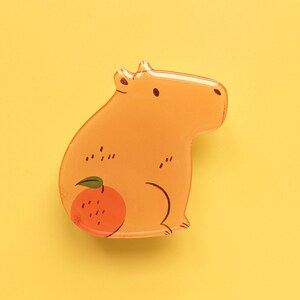 Lindo capibara con naranja, soporte para teléfono, accesorio para teléfono, soporte de pie, conejillo de indias gigante con mandarina, mandarina