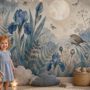 May include: A wall mural featuring a watercolor illustration of large blue iris flowers, ferns, and wildflowers under a full moon. The scene includes flying butterflies and a small bird perched on a stem, set against a soft, muted blue and beige background.