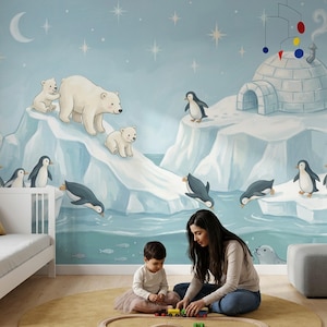 May include: A whimsical nursery scene featuring a mural of polar bears, penguins, and an igloo on a light blue background. A white crib and a yellow rug with a toy train set are in the foreground. A woman and a child are playing with the train.