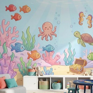 May include: A whimsical children's room featuring an underwater theme. The wall mural depicts colorful cartoon sea creatures like fish, an octopus, seahorses, and a turtle. The room includes a small sofa, a round rug, a table, stools, and storage shelves.