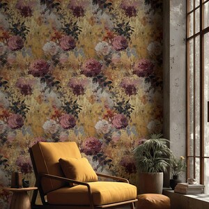 May include: A room with floral wallpaper featuring large, watercolour-style roses in pink, burgundy, and cream against a golden-yellow backdrop. A mustard-coloured armchair and side table are in the foreground.