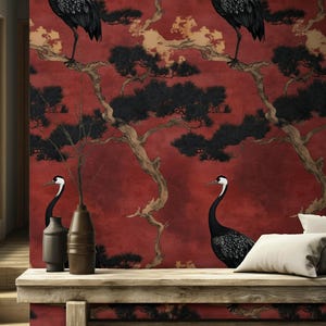 May include: Red wallpaper featuring a Japanese crane design. The wallpaper has a red background with black pine trees and branches, and black and white cranes. The scene is reminiscent of traditional Japanese art.