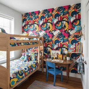 May include: A children's bedroom with a wooden bunk bed, a small desk, and a vibrant, colorful patterned wallpaper. The bedding and wallpaper feature a similar abstract design with blue, yellow, and red accents. A blue chair sits at the desk.