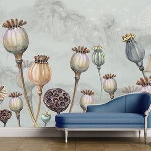 May include: A watercolour illustration of a wall mural featuring a light blue background with a variety of dried poppy seed pods in shades of brown, grey, and purple. A blue chaise lounge is positioned in front of the wall.