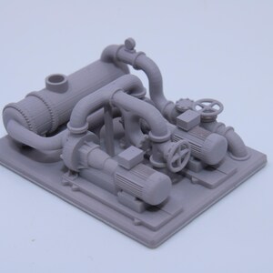 May include: A light gray miniature industrial pump station model featuring two electric motors, interconnected piping, a cylindrical tank, and manual hand wheels mounted on a rectangular base. The detailed 3D printed assembly displays mechanical components.