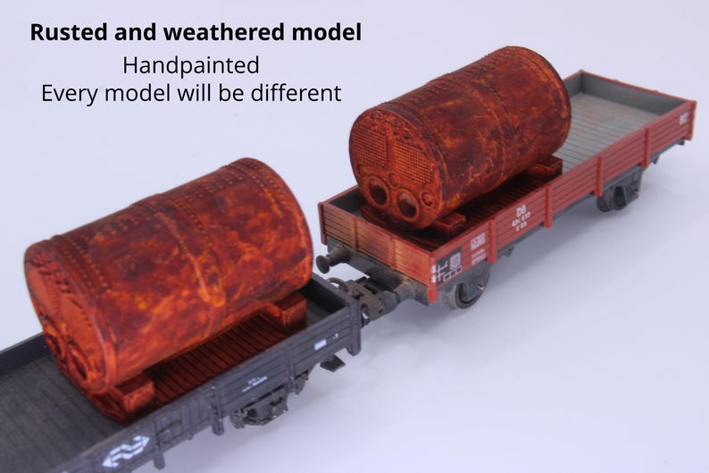 May include: Two model train flatcars, each carrying a large, cylindrical, rusted and weathered tank. The text on the image reads: Rusted and weathered model, Handpainted, Every model will be different. The flatcars are dark gray with red sides.
