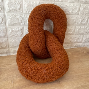 Rust boucle chain pillow