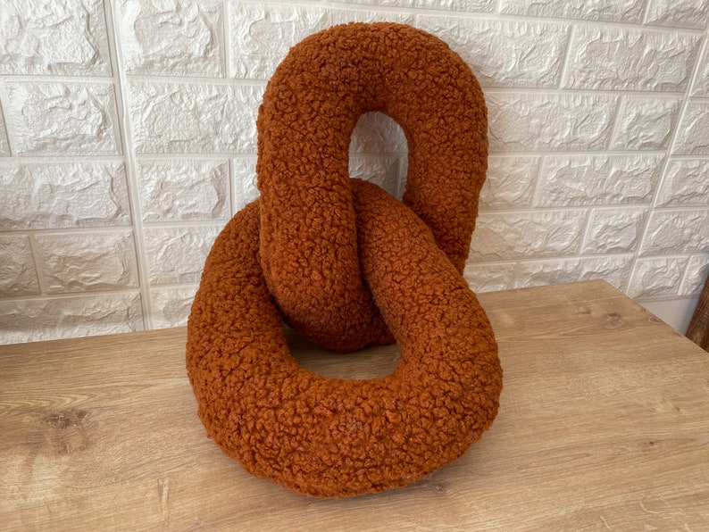 Rust boucle chain pillow