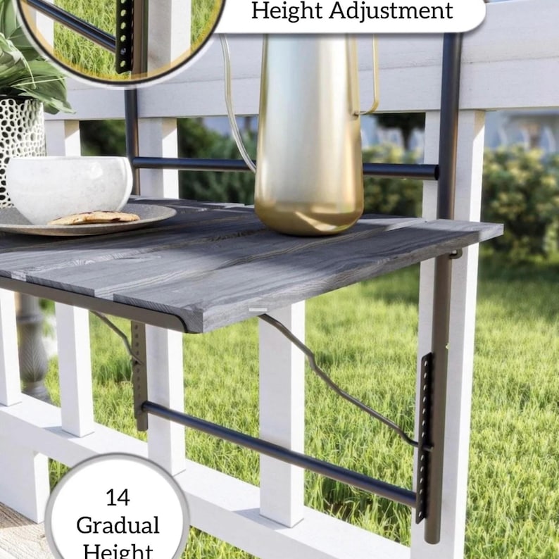 May include: Black metal folding table with a gray wooden top, attached to a white railing. The table has a height adjustment feature with 14 gradual height settings. "Height Adjustment" is written on the image.