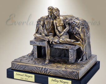 May include: Bronze sculpture of a couple sitting on a bench, with a plaque on the base that reads "Samuel Meyers 1942 - 2015" and "Salley Meyers 1943 - 2017".