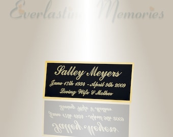 Puede incluir: Una placa negra con letras doradas que dice "Salley Meyers, June 17th 1994 - April 9th 2009, Loving Wife & Mother".