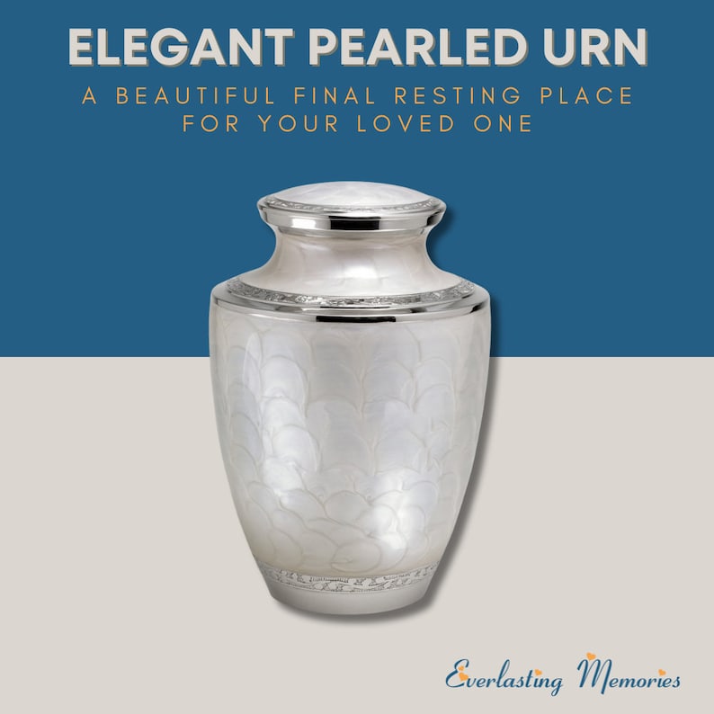 May include: A white pearlescent urn with silver trim. The urn has a decorative design of overlapping circles. The urn is a beautiful final resting place for your loved one.  "Elegant Pearled Urn" and "A Beautiful Final Resting Place For Your Loved One" are written in gold text on a blue background.