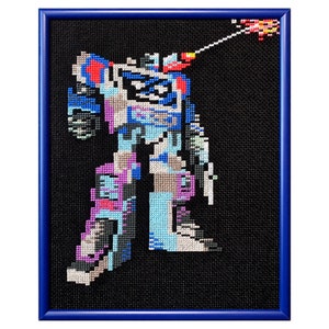 May include: A framed cross-stitch artwork depicting a blue and purple robot firing a weapon. The robot is standing on a black background.