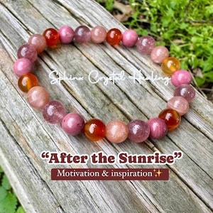 May include: A beaded bracelet featuring round, polished stones in shades of orange, pink, and translucent red. The text "Sphinx Crystal Healing" and "After the Sunrise" with the subtitle "Motivation & inspiration" is overlaid on the image.