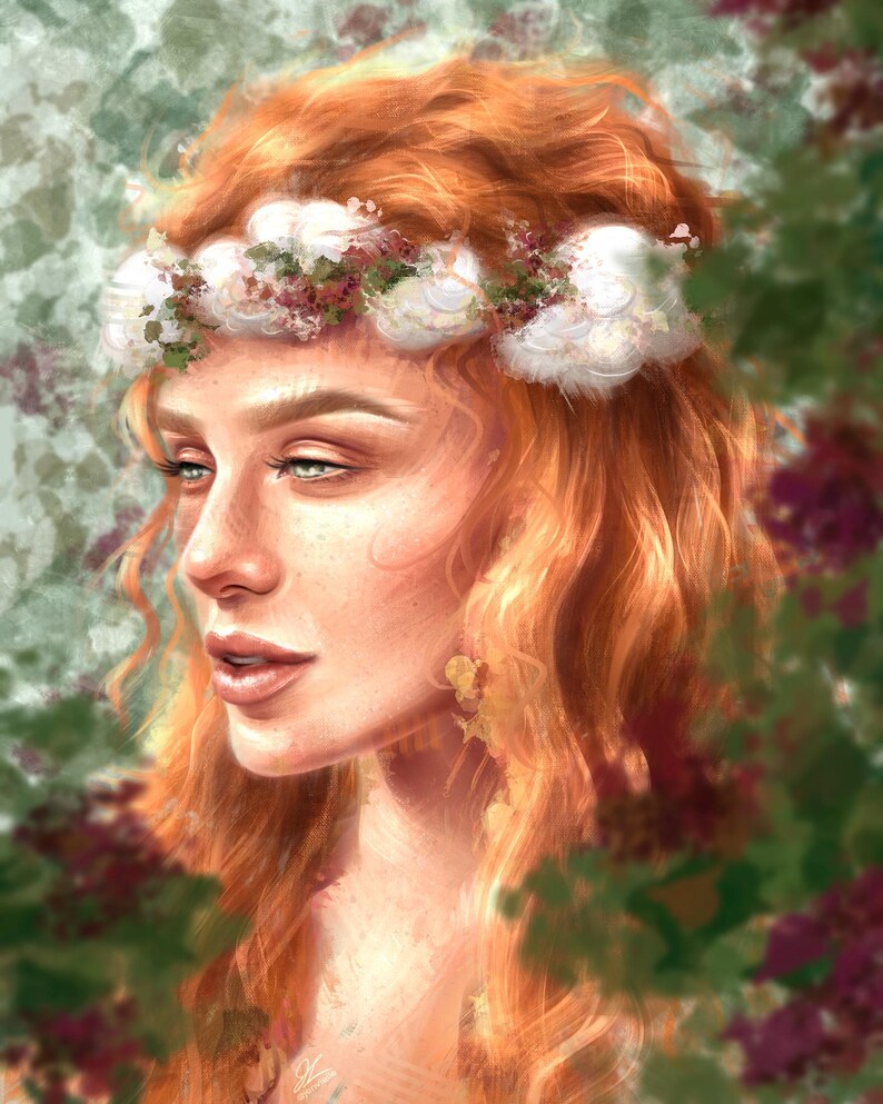 May include: A woman with long, curly red hair wears a white flower crown. The flowers are arranged in a circle around her head. She is looking to the side with a soft smile. The background is blurred and features green and purple foliage.