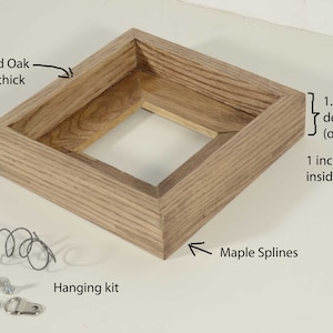 May include: A 1.5 inch deep solid oak picture frame with a 1 inch deep inside dimension. The frame is made of 1/2 inch thick oak and has maple splines. The frame comes with a hanging kit.
