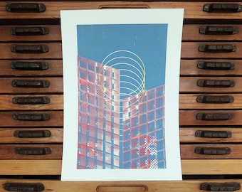May include: A colorful abstract print of a building with a yellow and blue geometric pattern overlay. The print is on a white background.
