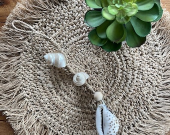 White wooden beaded necklace or door clasp with large tiger shell and two pearly shells