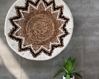 Braided wall decoration in banana leaves entirely embroidered with black and black wool - diameter 60 cm - Awa model