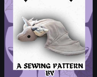 May include: A sewing pattern for a plush bat toy. The pattern is a digital download, not a physical item. The pattern is by Foxbird Creations.