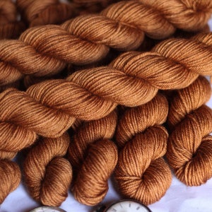 Bronze on superwash merino worsted/ DK weight yarn , hand dyed in small batches in the uk