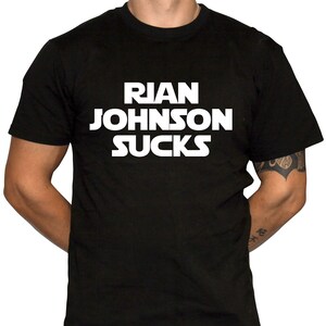 May include: Black t-shirt with white text that reads "Rian Johnson Sucks".