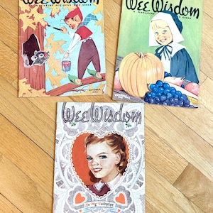 May include: Three vintage "Wee Wisdom" magazines. The covers feature illustrations of children, a pumpkin, and an elf painting leaves. The magazines are dated October 1950, November 1950, and February 1951. The magazines are on a wooden surface.