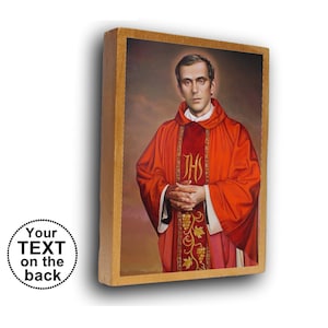 May include: A rectangular wooden plaque featuring a portrait of a man in a red liturgical vestment with gold JHS embroidery and grape vine details. The man has short brown hair and a halo. A circular graphic with the text Your TEXT on the back.