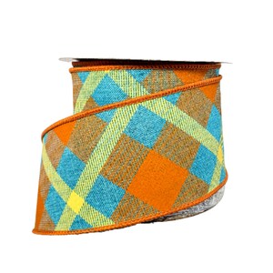 May include: A roll of orange, blue, and yellow plaid ribbon. The ribbon has a wired edge and is perfect for crafting and decorating.