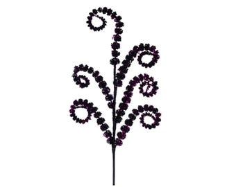 May include: A decorative floral stem with a dark purple color. The stem has a central stalk with spiraling, circular clusters of small, dark purple beads. The overall design is symmetrical and elegant, suitable for various decorative purposes.
