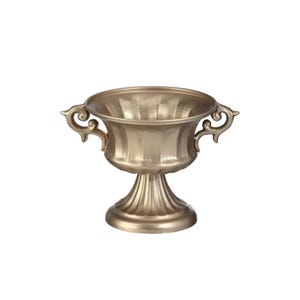 May include: A gold-colored decorative urn with two ornate handles and a pedestal base. The urn has a fluted design and a wide opening, suitable for floral arrangements or decorative display. The background is plain white.