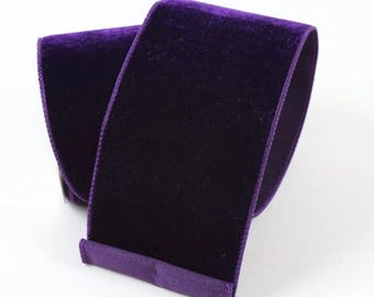May include: A roll of deep purple velvet ribbon. The ribbon is soft and luxurious, perfect for adding a touch of elegance to any project.