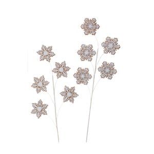 May include: Artificial snowflake stems with white and brown snowflake ornaments. The snowflake ornaments have a detailed, openwork design. The stems are white and the snowflakes are a mix of white and brown. These are ideal for winter and holiday decor.