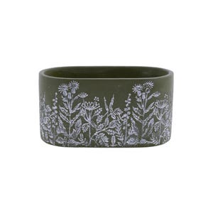 May include: An olive green rectangular ceramic planter with a white floral design. The planter features a detailed relief pattern of various wildflowers and foliage around the exterior. The design is a nature-inspired decorative element.