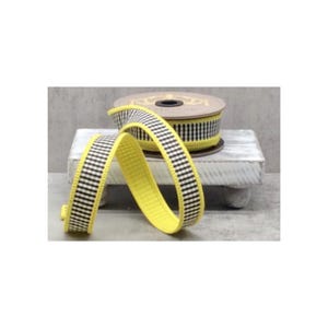 May include: A roll of decorative ribbon with a yellow base and a black and white checkered pattern. A length of the ribbon is unrolled and draped in front of the roll. The ribbon is displayed on a small, white, wooden stand.