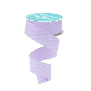 May include: A roll of light purple ribbon with a diamond pattern. The ribbon is unspooled, revealing its texture and color. The spool has the text "RG Ribbon" printed on it.