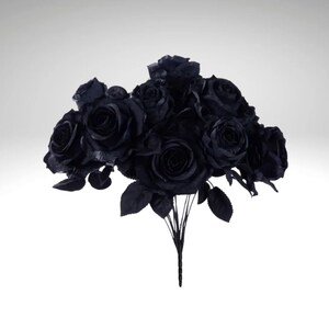 May include: A bouquet of black roses with dark green leaves and stems. The artificial flowers are clustered together, creating a full and dramatic arrangement. The roses are in full bloom, with detailed petals.