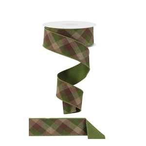 May include: A spool of wired ribbon featuring a diagonal plaid pattern in shades of olive green, dark brown, and tan. The ribbon is wound around a white plastic core, with a loose end extending downward to display the woven texture and pattern.